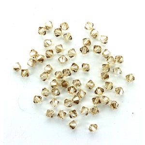 Swarovski 5 mm goldenen Schatten Bicone Perlen.  Preis ist für 10 Perlen