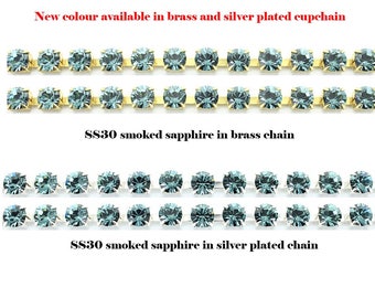 Rhinestone SS30 6mm chain with smoked sapphire stones in silver plated or brass cupchain.  Price is for 1 meter