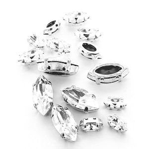 Crystal or colours navettes 15x7, 10x5, 8x4 in sew on settings silver and gold.  Price is for 10 and 100 pieces.
