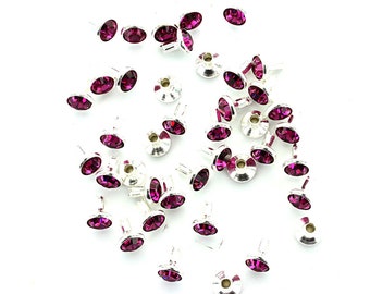 Swarovski 53000 crystal rivets and 53001 fuchsia rivets.  Price is for 10 pieces