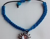 Blue with Black Knotted Bracelet with a Sun Charm