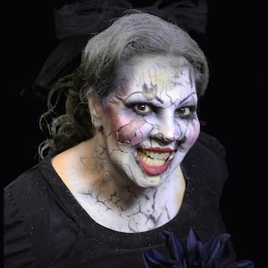 Cracked doll foam latex prosthetic, unpainted. I can paint it for an added fee.