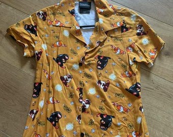 Cute, dark gold critter shirt. Size xs