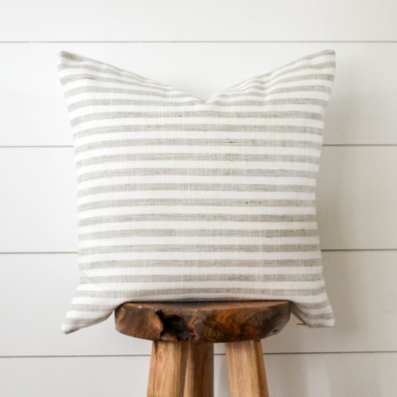 grey and white striped pillow