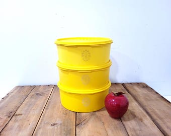 Yellow Tupperware canisters, stackable containers canisters in bright yellow, retro, yellow canisters,
