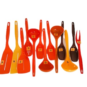 Foley utensils, plastic kitchen utensils, nylon utensils, orange, yellow, brown, slotted spoon, serving spoon, spatula, ladle, fork,