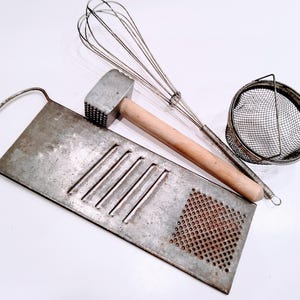 Lot of Primitive kitchen utensils, handheld grater, wooden handle, metal whisk, meat tenderizer, meat hammer, farmhouse kitchen, rustic,