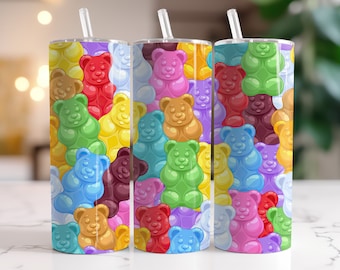 May include: Three colorful stainless steel tumblers with lids and straws. Each tumbler features a different pattern of gummy bear shaped designs in various colors, including red, orange, yellow, green, blue, purple, and pink.