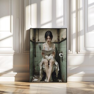 May include: A framed art print depicts a person seated on a toilet, engrossed in reading a newspaper. The setting is a small, aged bathroom with green tiled walls and exposed pipes. The person is wearing a light-colored dress.