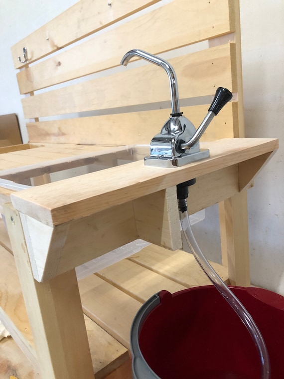 mud kitchen with water pump