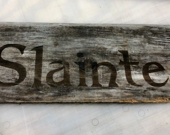 Slainte laser etched sign on weathered board