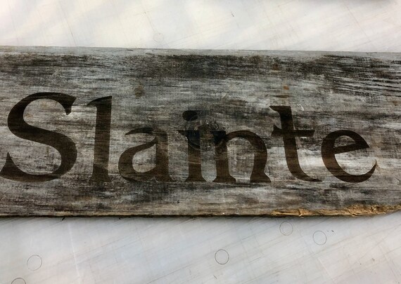 Slainte laser etched sign on weathered board
