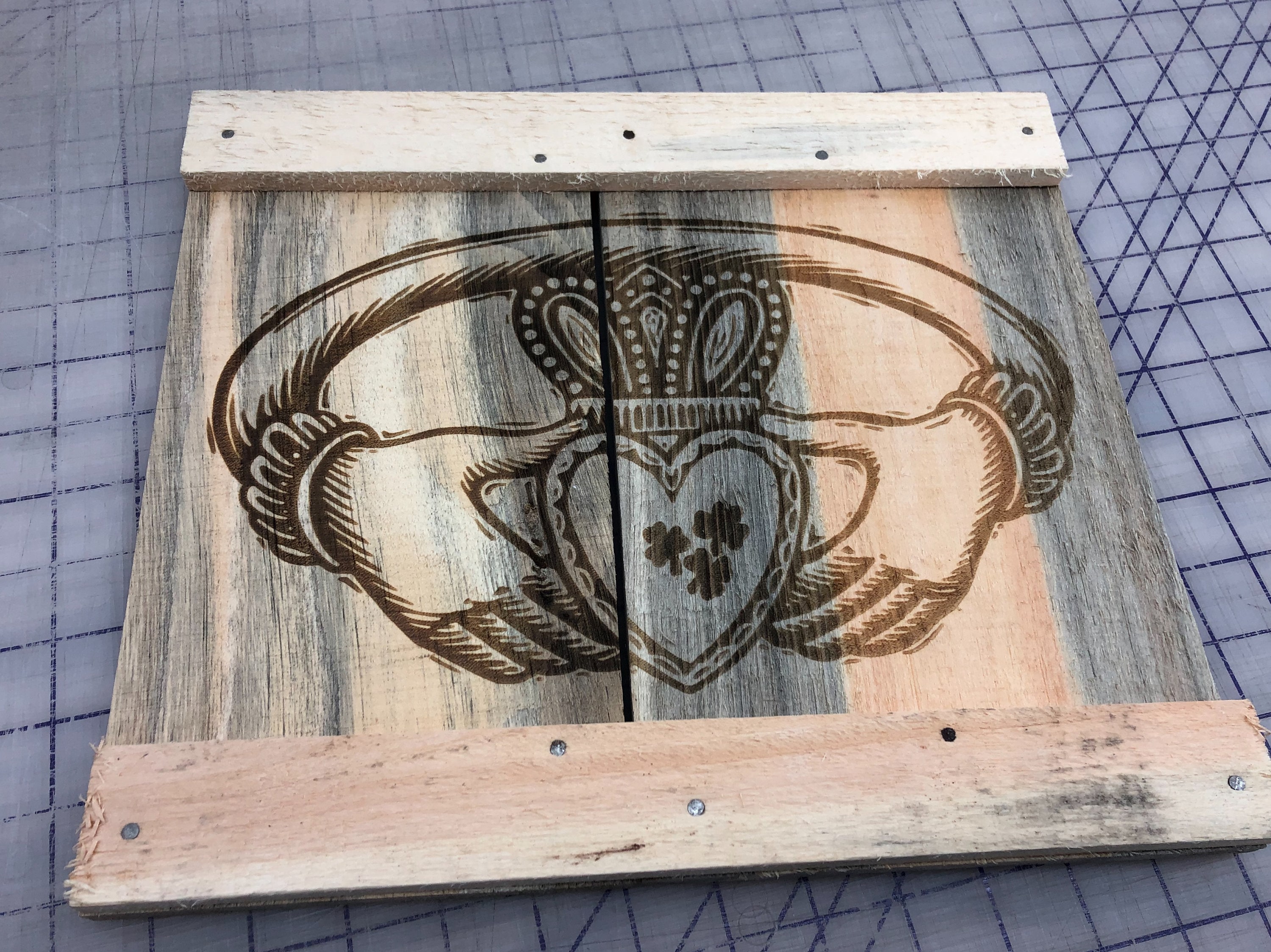 Slainte laser etched sign on weathered board