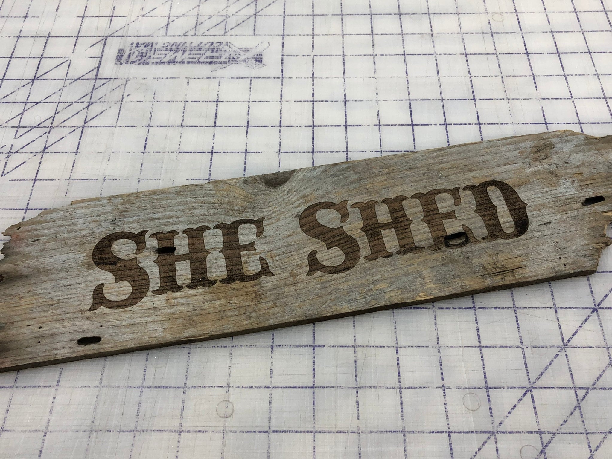 Slainte laser etched sign on weathered board