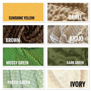 May include: A collection of fabric swatches in various colors, including sunshine yellow, camel, brown, khaki, mossy green, dark green, pastel green, and ivory. Each swatch has a textured, dotted surface with the color name in bold white text.