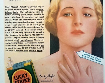 May include: A vintage Lucky Strike cigarette advertisement featuring a woman with blonde hair and a red dress. The ad text reads "Consider your Adam's Apple!! Don't Rasp Your Throat With Harsh Irritants" and "Reach for a LUCKY instead". The ad also features a pack of Lucky Strike cigarettes with the slogan "It's Toasted".