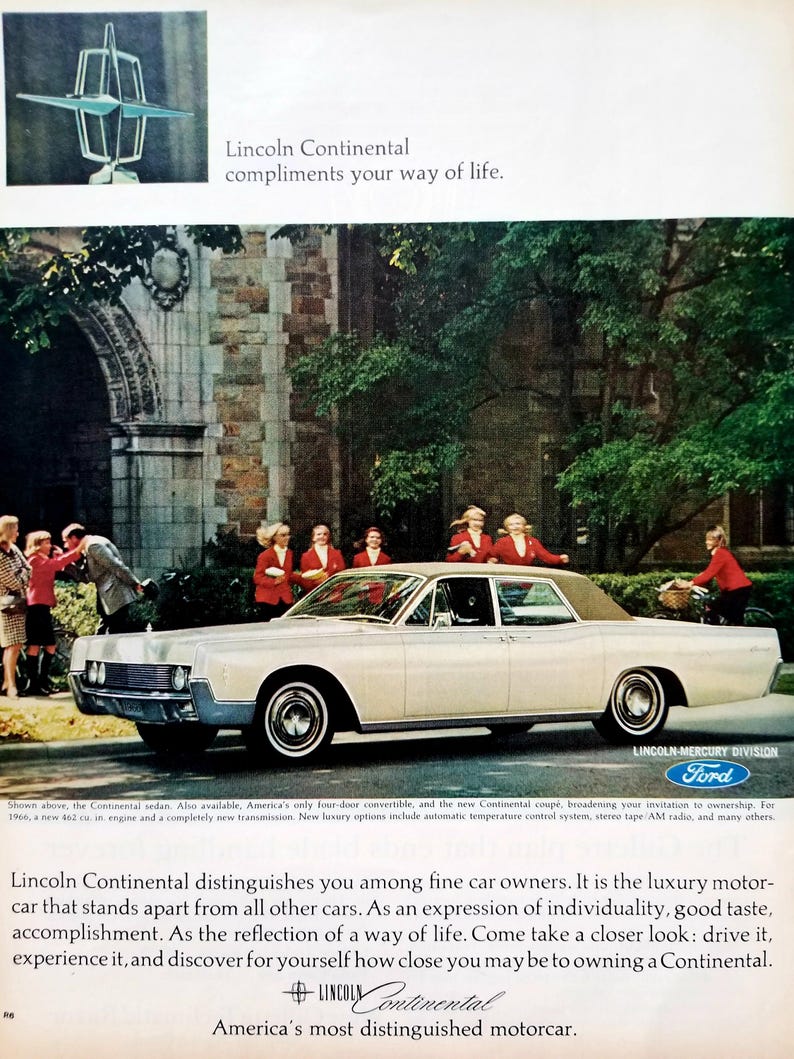 May include: Vintage advertisement for a white Lincoln Continental sedan. The car is parked on a street with people in the background. The ad includes the text "Lincoln Continental compliments your way of life."