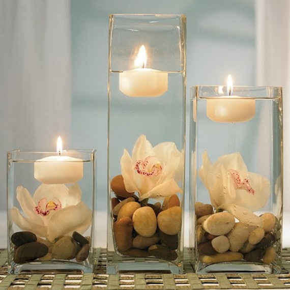 Three cylinder vases with clear water beads and white, ivory and a