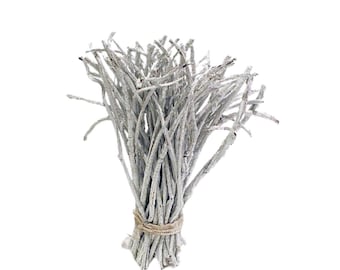 May include: A bundle of small, light gray branches tied together with twine. The branches have a textured appearance and are arranged in a compact, upright form. The background is plain white, highlighting the natural, organic aesthetic of the decorative item.