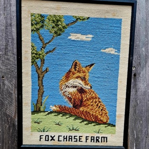 May include: A framed needlepoint picture of a fox sitting in a field with a tree and blue sky. The text "FOX CHASE FARM" is at the bottom of the picture.