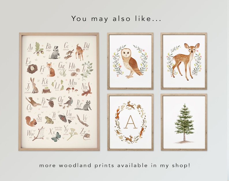 May include: A set of six woodland-themed prints featuring an alphabet chart, an owl, a deer, a tree, and a wreath with the letter A. The prints are framed in natural wood.