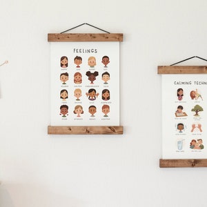 May include: Two framed posters with illustrations. The first poster is titled "Feelings" and shows a variety of faces expressing different emotions. The second poster is titled "Calming Techniques" and shows illustrations of different calming activities.