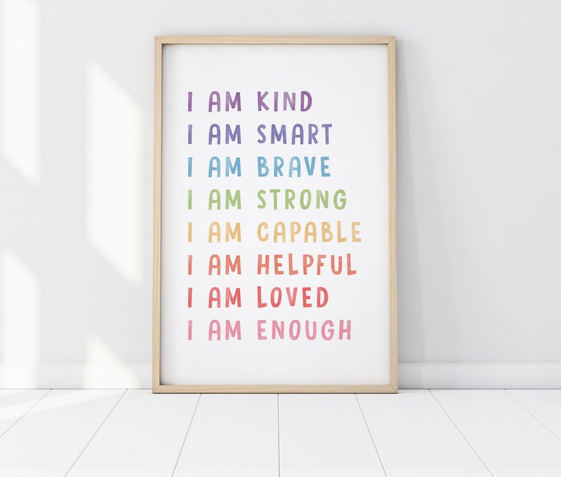 May include: A framed print with the text "I am kind, I am smart, I am brave, I am strong, I am capable, I am helpful, I am loved, I am enough" in a rainbow color scheme.