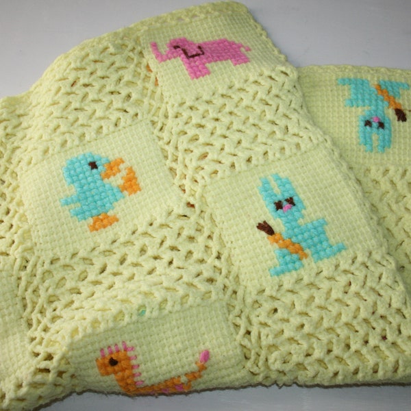 Adorable baby blanket. Bright yellow knitted with Darling animals,duck,giraffe,bear,cat,elephant,horse ,bunny. 30" X 30"
