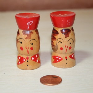 Tiny wooden vintage Japan made salt and pepper shaker set 2 inch tall hand painted girl with red hat