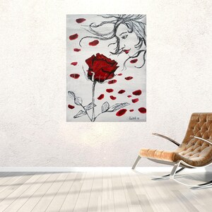 May include: A black and white painting of a woman with flowing hair, looking at a red rose with petals falling around it.