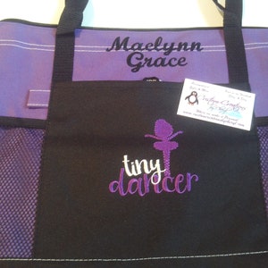 May include: Purple and black tote bag with a mesh pocket. The bag is embroidered with the text "Maelynn Grace" and "tiny dancer" with a purple ballerina silhouette.