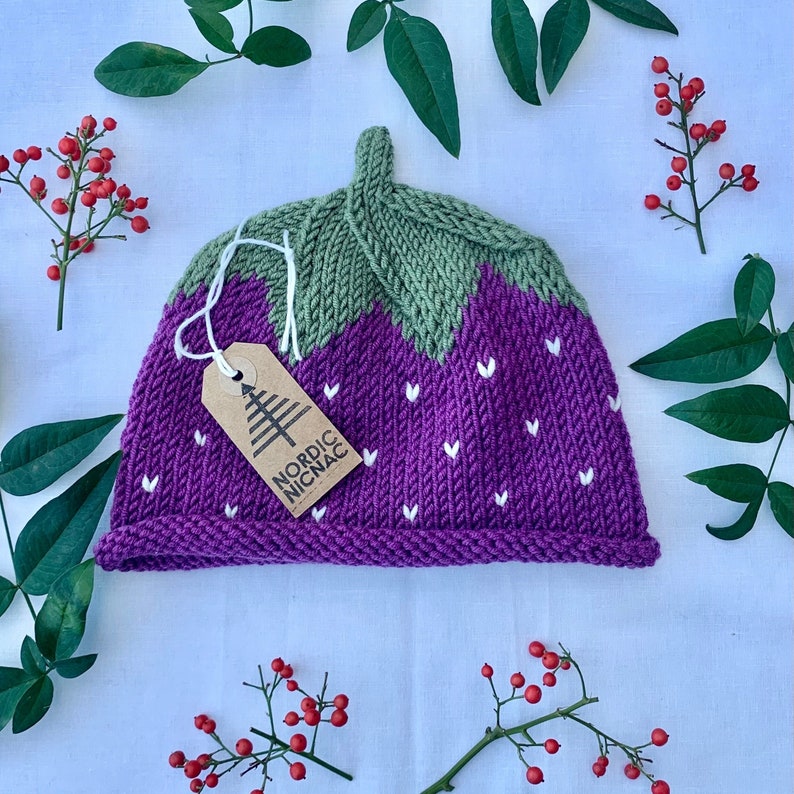 Plum merino hat with light green top.