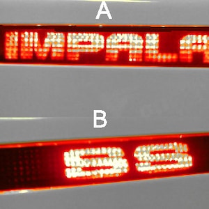 May include: Three red illuminated car emblems with white lettering. The top emblem reads "IMPALA", the middle emblem reads "SS", and the bottom emblem reads "Impala".