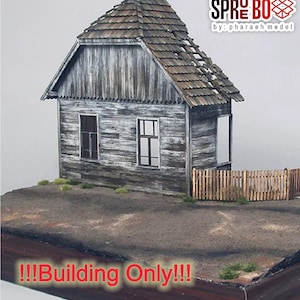 May include: A weathered wooden model house with a distressed appearance. The gray structure features a partially damaged roof, two windows, and a small wooden fence. The text "!!!Building Only!!!" is displayed at the bottom.