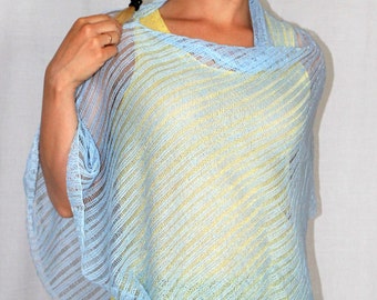 May include: A light blue knitted poncho with a yellow under layer. The poncho has a loose fit and a diagonal striped pattern.