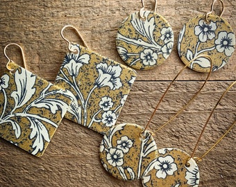 gold with white floral earrings