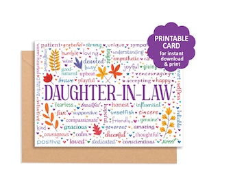 May include: A white greeting card with the text DAUGHTER-IN-LAW in large purple letters, surrounded by colorful words like patient, grateful, and strong, interspersed with small autumn leaf illustrations and hearts, resting on a brown envelope.