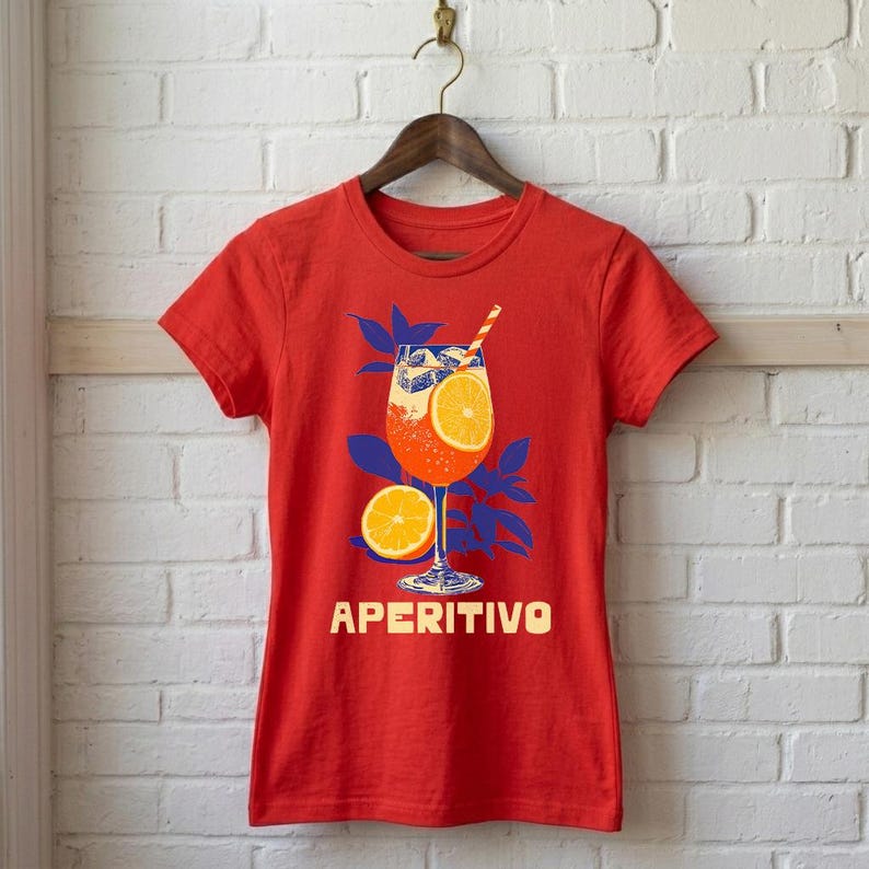 Aperitivo Italian summer tee in red on hanger — women's fitted graphic shirt with bold vintage spritz cocktail design, orange and blue linocut illustration