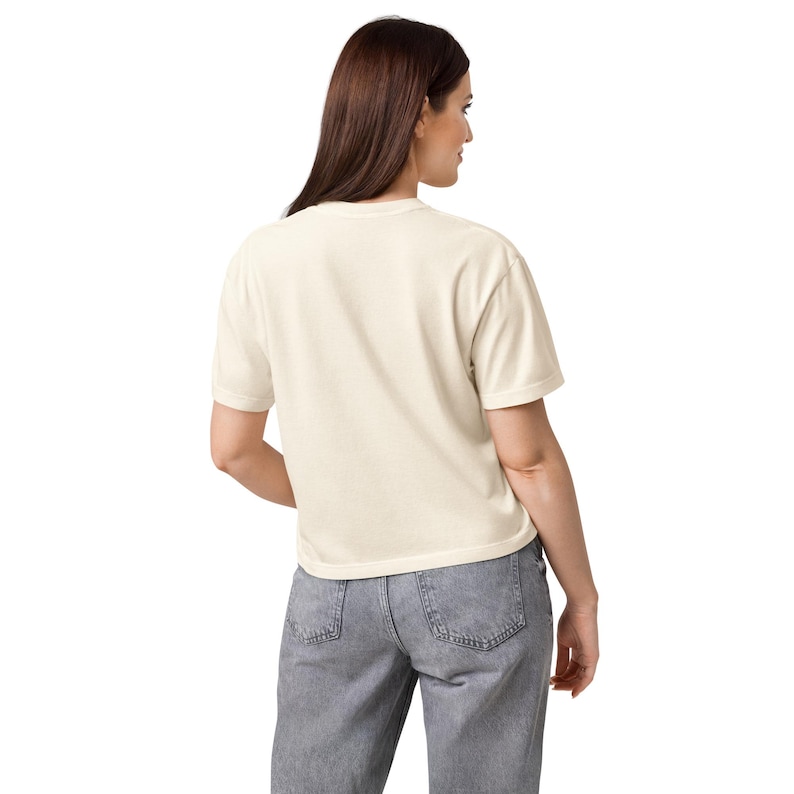 Boxy comfort color crop shown from the back to show the square silhouette, relaxed cropped fit on an ivory tee