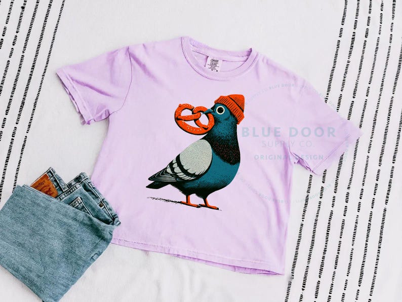 Pigeon crop in orchid styled with folded denim, funny NYC pigeon clutching an oversized soft pretzel