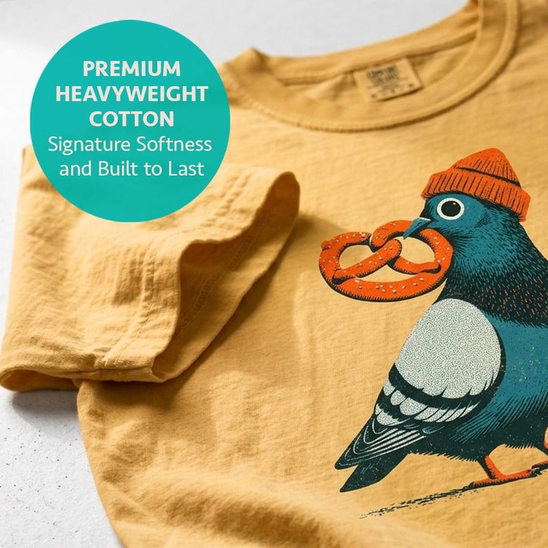 Bird nerd shirt in mustard, folded to show the heavyweight cotton and neckline, block print pigeon design