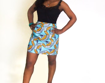 May include: A blue and yellow patterned skirt with a black tank top. The skirt has a geometric design with curved lines and circles.