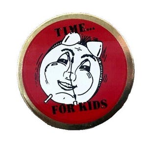 May include: A red and gold round pin with a black and white illustration of a clock face with a smiling face. The text "TIME... FOR KIDS" is printed on the pin.