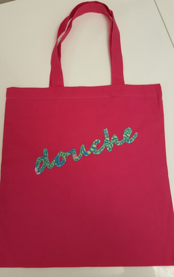 Pink written bag hotsell