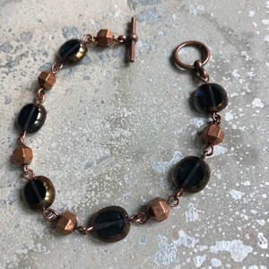 Copper and navy  metal and glass bead bracelet.