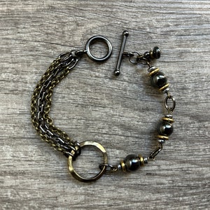 Mixed metal chain and loop bracelet