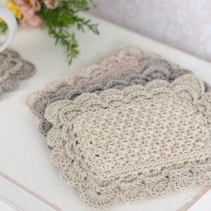 Crochet scalloped mug rug stack.