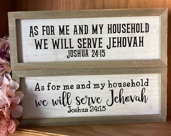 May include: A wooden sign with a white background and black text. The sign reads "As for me and my household we will serve Jehovah Joshua 24:15".