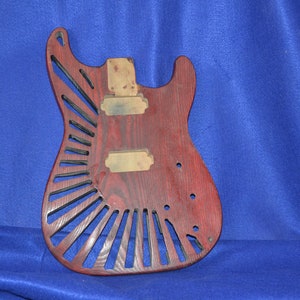 Custom dual humbucker strat style with fan type custom route to make it lighter and very cool.