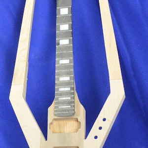 Custom guitar body with built in neck.